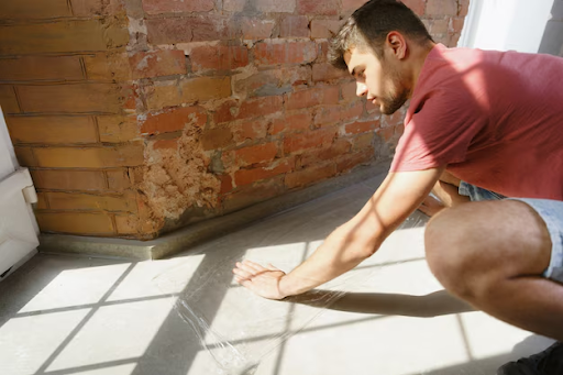 Cracked tiles due to foundation movement.